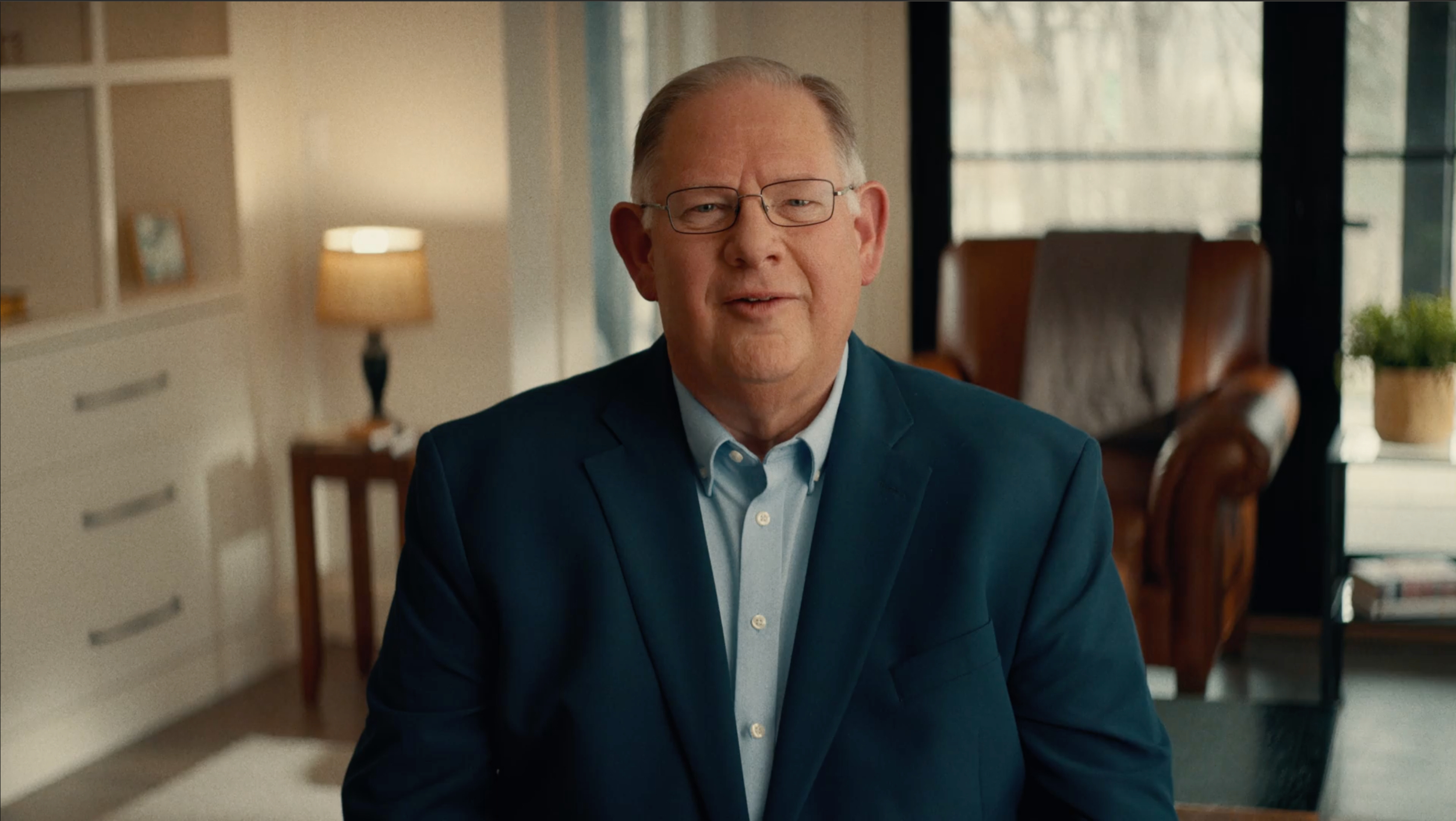 Dan Hawkins seated in an office in a campaign photograph